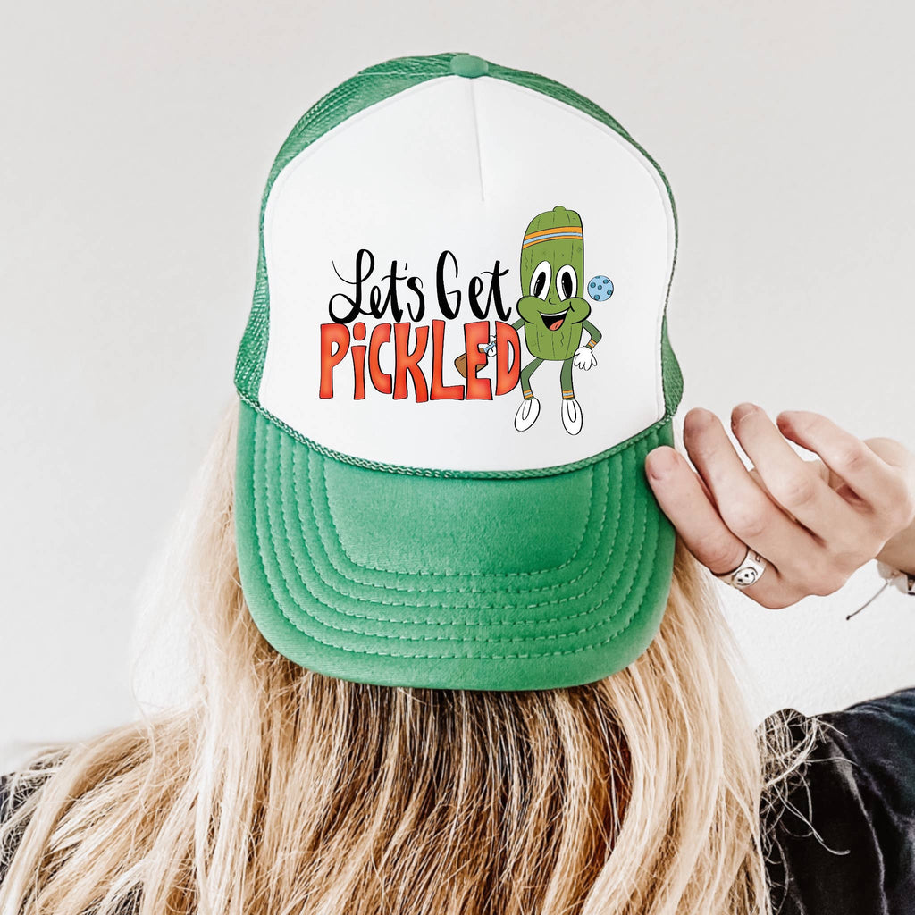 a person wearing a green and white hat with the words let's get picked