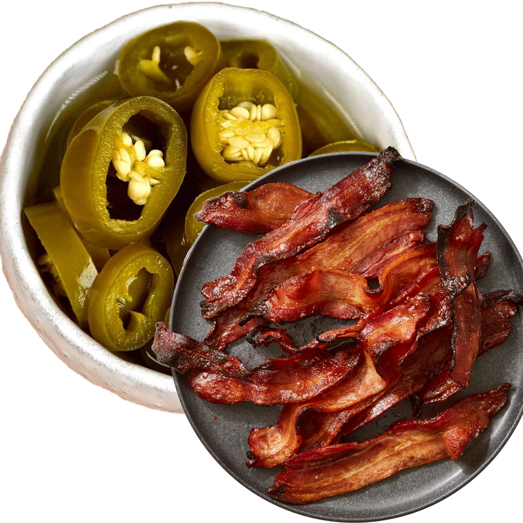 a bowl of bacon and jalapenos on a plate