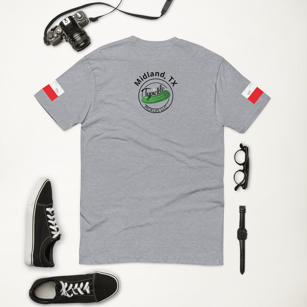 a pair of sneakers, a camera, and a t - shirt on a white