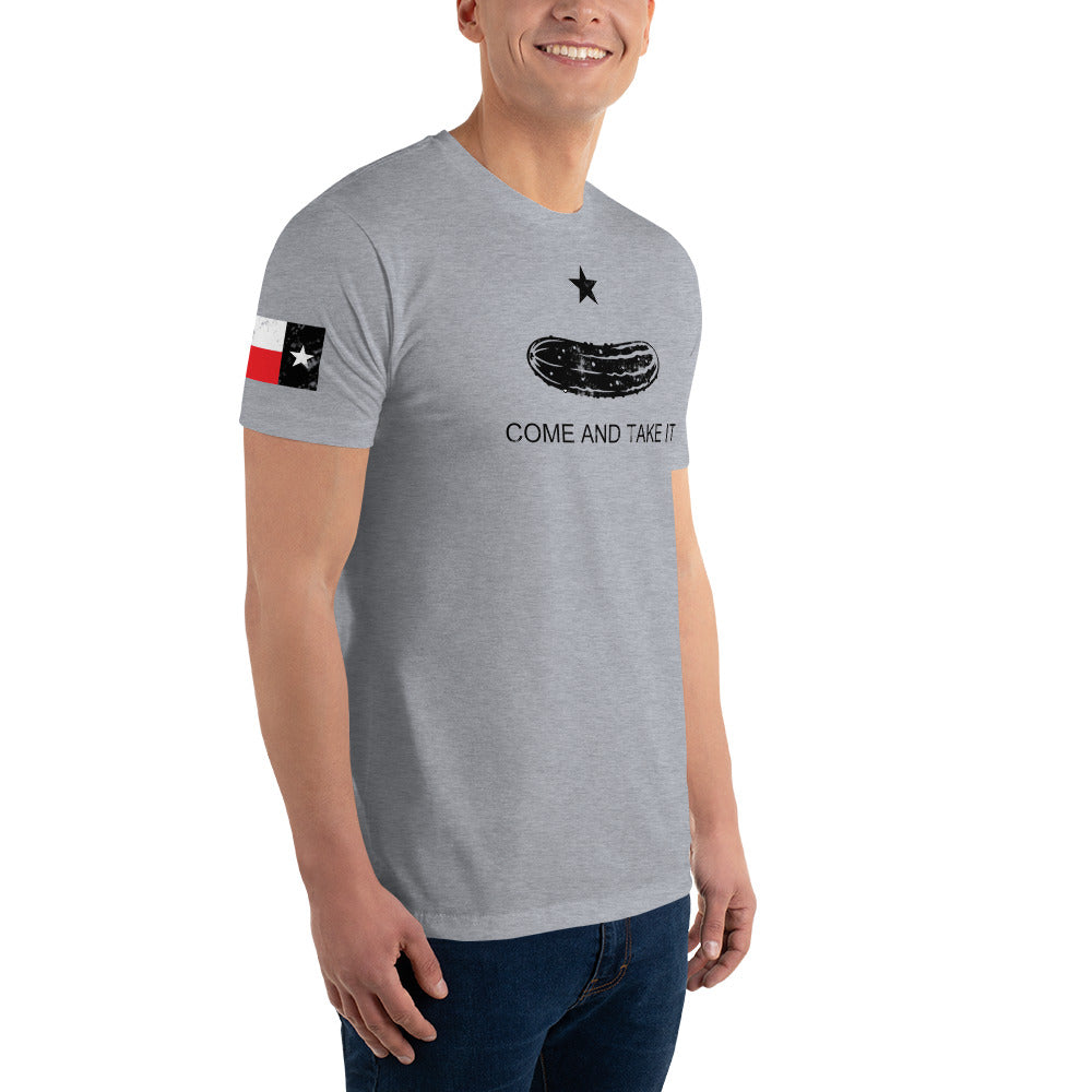 a man wearing a grey t - shirt with a Texas flag on it